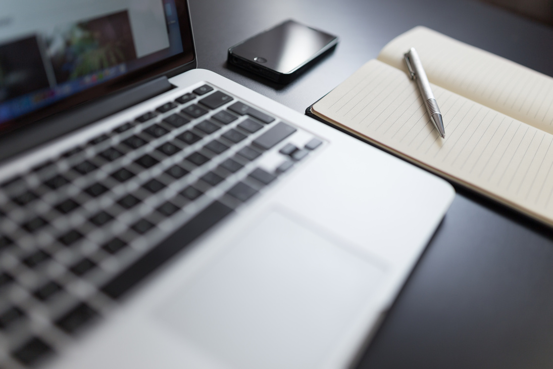 Silver Laptop Near Notebook and Smartphone on Table